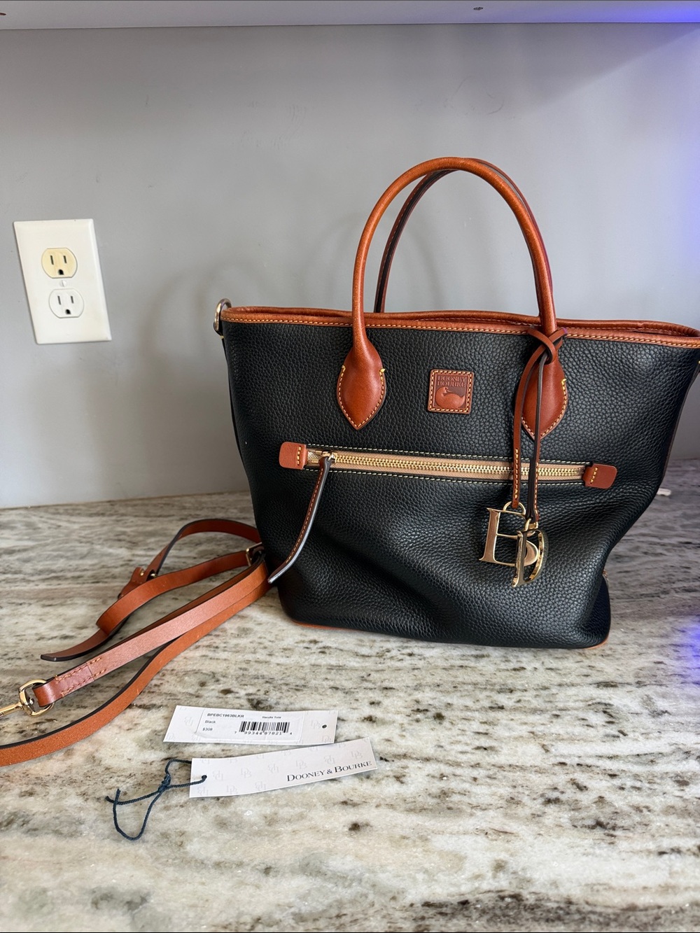 Dooney & Bourke Black Pebbled Leather Tote with Brown Trim and Gold Hardware
